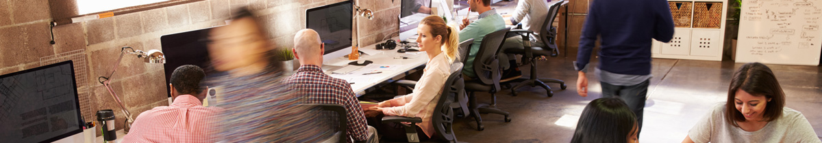 Workers In Busy Modern Design Office